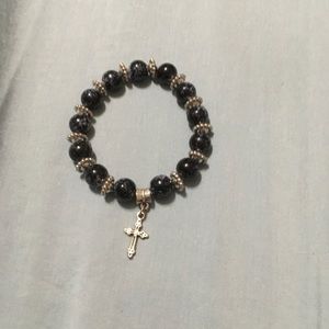 Handmade beaded bracelet with a cross